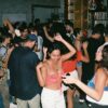 a group of people dancing at a party