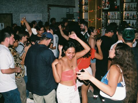 a group of people dancing at a party