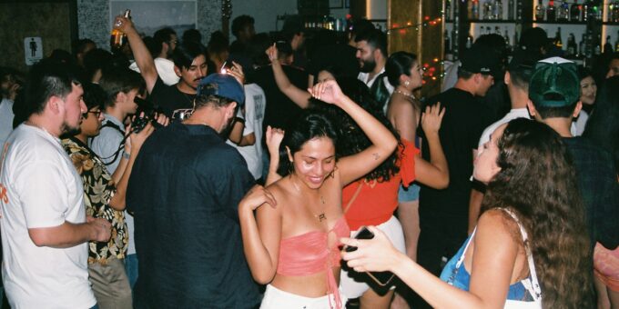 a group of people dancing at a party