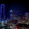 aerial photography of city with high-rise buildings during night time