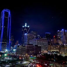 aerial photography of city with high-rise buildings during night time