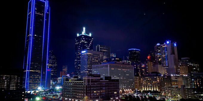 aerial photography of city with high-rise buildings during night time